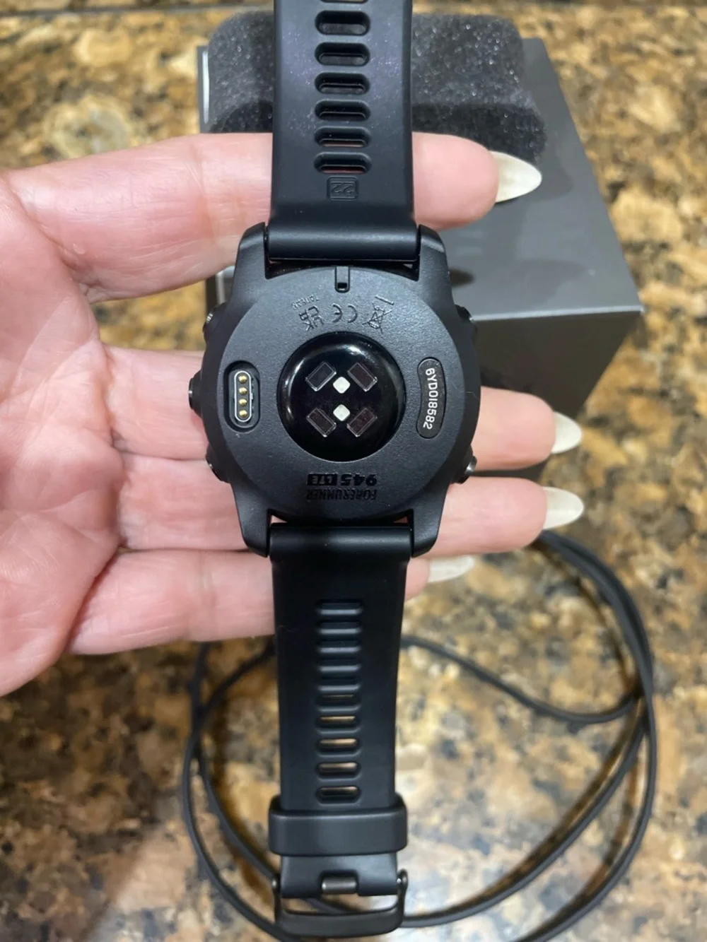 garmin black sports GPS smartwatch with black silicone band